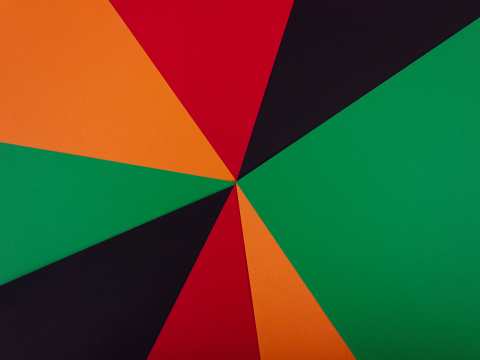 Red, orange, green and black geometric design representing Afro-American flag
