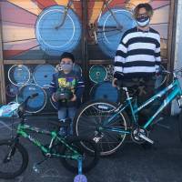 Two people with bikes.