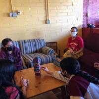 People playing Jenga at the Bi-National Arts Institute