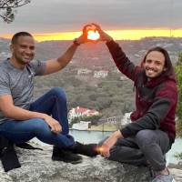 Two LGBTQ+ Alliance Fund grantees holding hands in shape of heart in Florence
