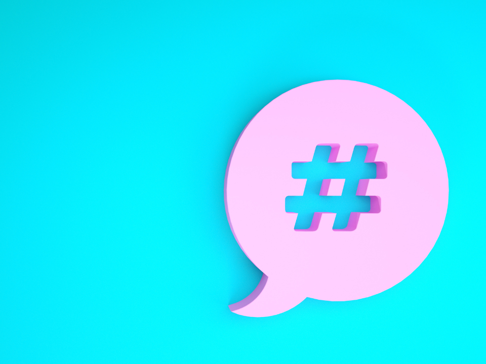 A pink hashtag symbol with a blue background.