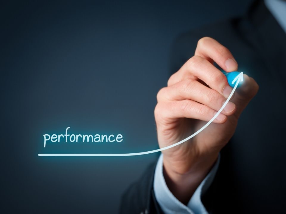 Hand drawing a line with under the word, "performance."